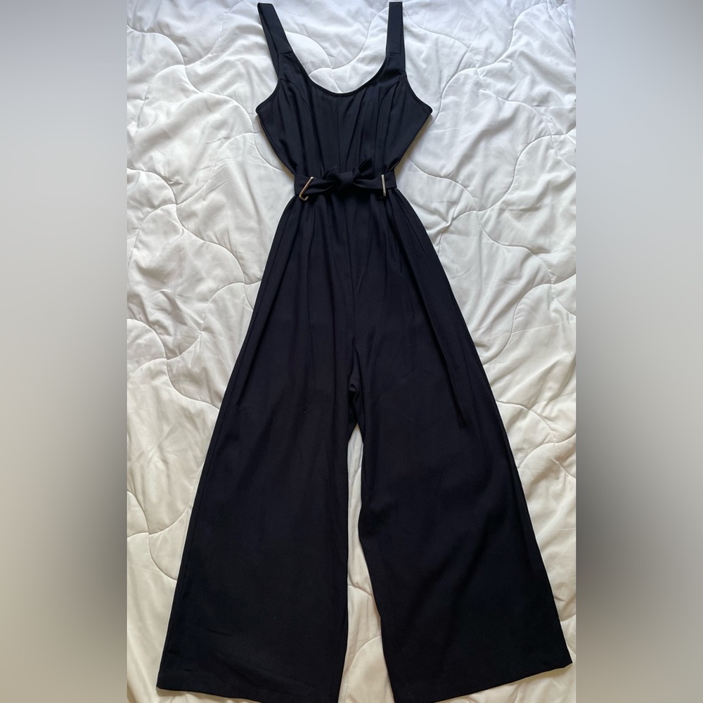 Navy blue jumpsuit with tie waist detailing 100% polyester